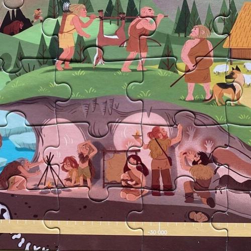 Un puzzle représentant une scène de vie de la préhistoire